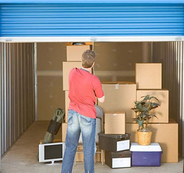 Person closing a storage garage door